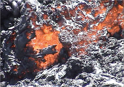 Figure 2.36: An ’a’a flow showing its jagged surface and massive molten interior.