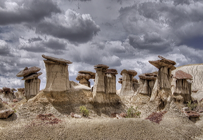 Figure 4.16: Sandstone hoodoos in the Ah-Shi-Sle-Pah Wilderness Study Area, San Juan County, New Mexico. A hoodoo forms when weathering erodes a softer material out from underneath a mass of harder capstone, leading to "mushroom" formations.