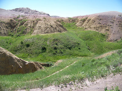 Figure 8.18: The Badlands of South Dakota form new soil quickly due to the phenomenal average erosion rate of approximately 2.5 centimeters (1 inch) per year.