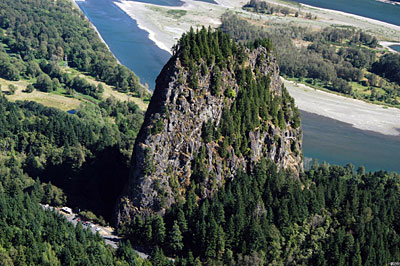 Figure 10.19: Beacon Rock is part of the Boring Lava Field in Oregon.  It is the central core of a cinder cone whose outer layers were stripped away 57,000 years ago by the Missoula Floods.