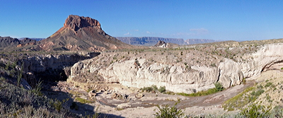 Figure 2.31: Igneous landscapes of Big Bend National Park. Tuff Canyon is composed of welded pyroclastic flows that occurred during the Paleogene. Cerro Castellan, in the background, is made up of a dense lava low underlain by tuff and basalt.