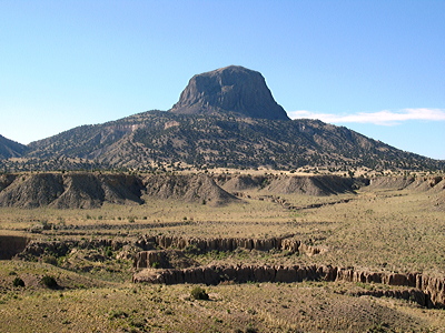 Figure 4.18: Cabezon Peak, a basalt volcanic plug that rises to 2373 meters (7785 feet) in elevation. It is part of the Mount Taylor Volcanic Field in New Mexico.