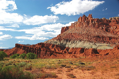 Figure 2.10: Triassic sediments at The Castle, Capitol Reef National Park, Utah. Three strata are visible here: the Wingate Sandstone (top), the Chinle Formation (middle), and the Moenkopi Formation (bottom).