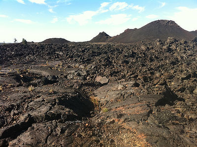 Figure 4.32: Craters of the Moon National Monument encompasses three major lava fields, spanning about 1000 square kilometers (400 square miles) along Idaho’s Snake River Plain. The area’s volcanic features include volcanic domes, basaltic flows, lava tubes, open rifts, and ash flows.