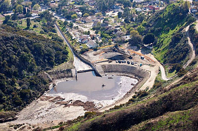 Figure 10.13: This debris basin in Los Angeles county is designed to capture the sediment, boulders, and other debris washed from the canyon during a storm.