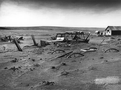 Figure 10.32: A car and other farm equipment lies buried following a dust storm near Dallas, South Dakota in 1936.