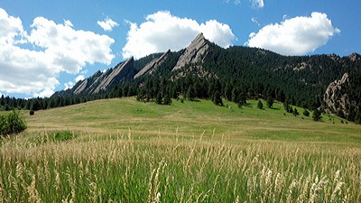 Figure 4.34: The Flatirons rise from the hilly grasslands of the Colorado Piedmont near Boulder, Colorado.