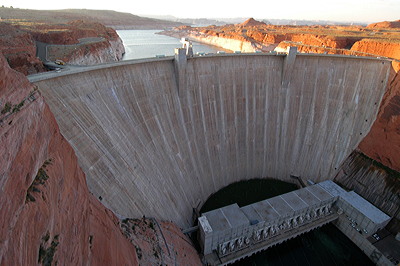 Figure 6.11: The Glen Canyon Dam in Coconino County, Arizona, with Lake Powell in the distance. The concrete arch of the dam is 220 meters (710 feet) high and 48 meters (1560 feet) wide.