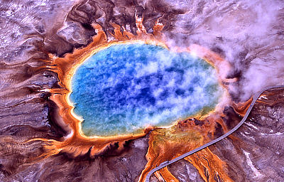 Figure 4.28: An aerial view of the Grand Prismatic Spring at Yellowstone National Park, the largest hot spring in North America, with an average diameter of 85 meters (275 feet). The spring’s bright colors are caused by bacteria that live in the water.