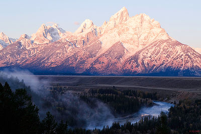 Figure 4.19: The Grand Tetons, some of the tallest mountains in Wyoming, as viewed from the Snake River Overlook. Grand Teton, the highest peak, is 4199 meters (13,775 feet) in elevation.