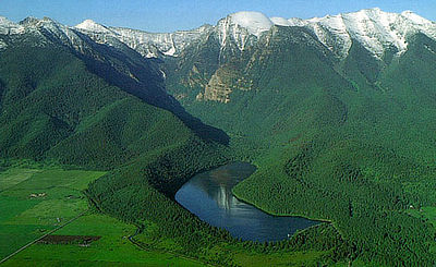Figure 6.7: The snakelike ridge in the foreground is a now-forested lateral moraine deposited by a valley glacier. Today, it curves along the left side of Mission Reservoir, located about 48 kilometers (30 miles) north of Missoula, Montana.