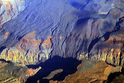 Figure 2.22: In this aerial view, the black basalt of the Uinkaret Volcanic Field is seen preserved where it cascaded over the side of the Grand Canyon at Lava Falls.