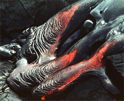 Figure 2.35: The skin on a pahoehoe flow is deformed by the motion of the underlying molten lava. The resulting texture is ropey and lumpy.
