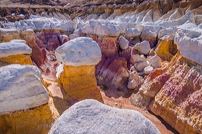 Figure 2.38: Ancient cultures and early settlers mined the brightly colored clays seen at the Paint Mines Interpretive Park, Colorado for use as pigment.