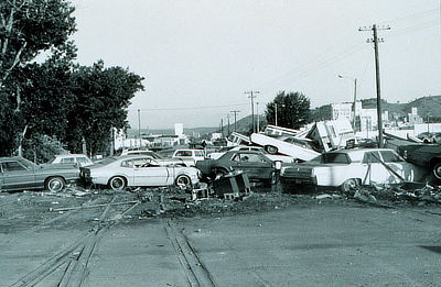 Figure 10.24: A pile of cars swept away by the 1972 Black Hills Flood. This event destroyed over 5000 vehicles.