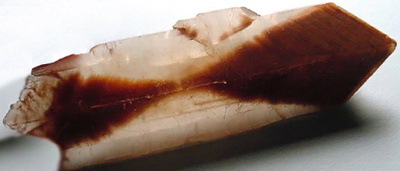 Figure 5.6: A selenite crystal from Salt Plains National Wildlife Refuge, Oklahoma with distinctive hourglass-shaped sand inclusion. Individual crystals up to 18 centimeters (7 inches) long have been found at this locality.