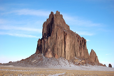 Figure 2.21: Shiprock, a volcanic monadnock in San Juan County, New Mexico, rises roughly 483 meters (1583 feet) above the desert plain.