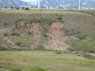 Figure 9.11: A hillslide slump in Rocky Flats National Wildlife Refuge, Colorado. The slump occurred on a steep, manmade embankment after a severe storm saturated the soil.