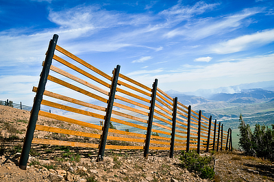 Figure 9.11: A snow fence near the Grand Tetons in Wyoming. Fences like these are used to force windblown snow to accumulate in a desired place, keeping it off roadways or collecting it for later use as a water supply.