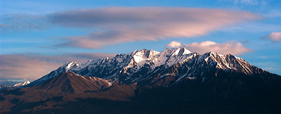 Figure 4.29: Mount Timpanogos in Utah’s Wasatch Range displays the sculpting power of moving ice. Alpine glaciers shaped the mountain’s knife-edge ridges and its wide U-shaped amphitheaters.