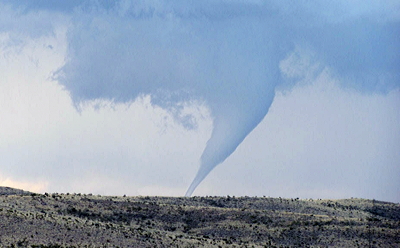 Figure 9.31: A tornado touches down over the hills near Roswell, New Mexico.