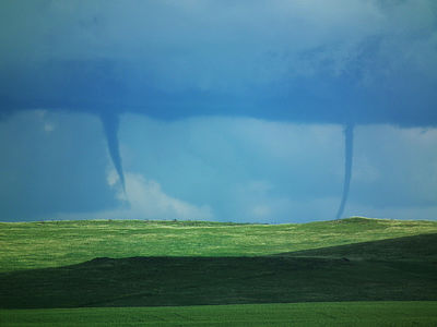 Figure 10.30: Two tornados touch down simultaneously in a South Dakota field between the towns of Enning and White Owl.