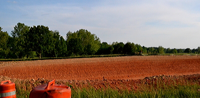 Figure 8.18: Vivid red Ultisols are exposed at the surface near a roadside in western Arkansas.
