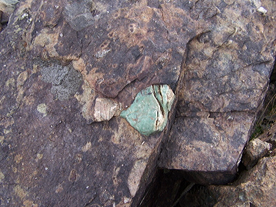 Figure 2.24: A piece of the Mineral Fork Tillite from Antelope Island, Utah. This rock is thought to have been deposited during the “Snowball Earth” Proterozoic glacial period, and is composed of glacial alluvium as well as embedded aventurine quartz.